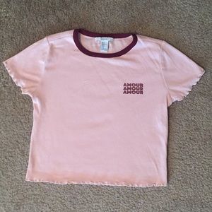 Pink crop top shirt.
